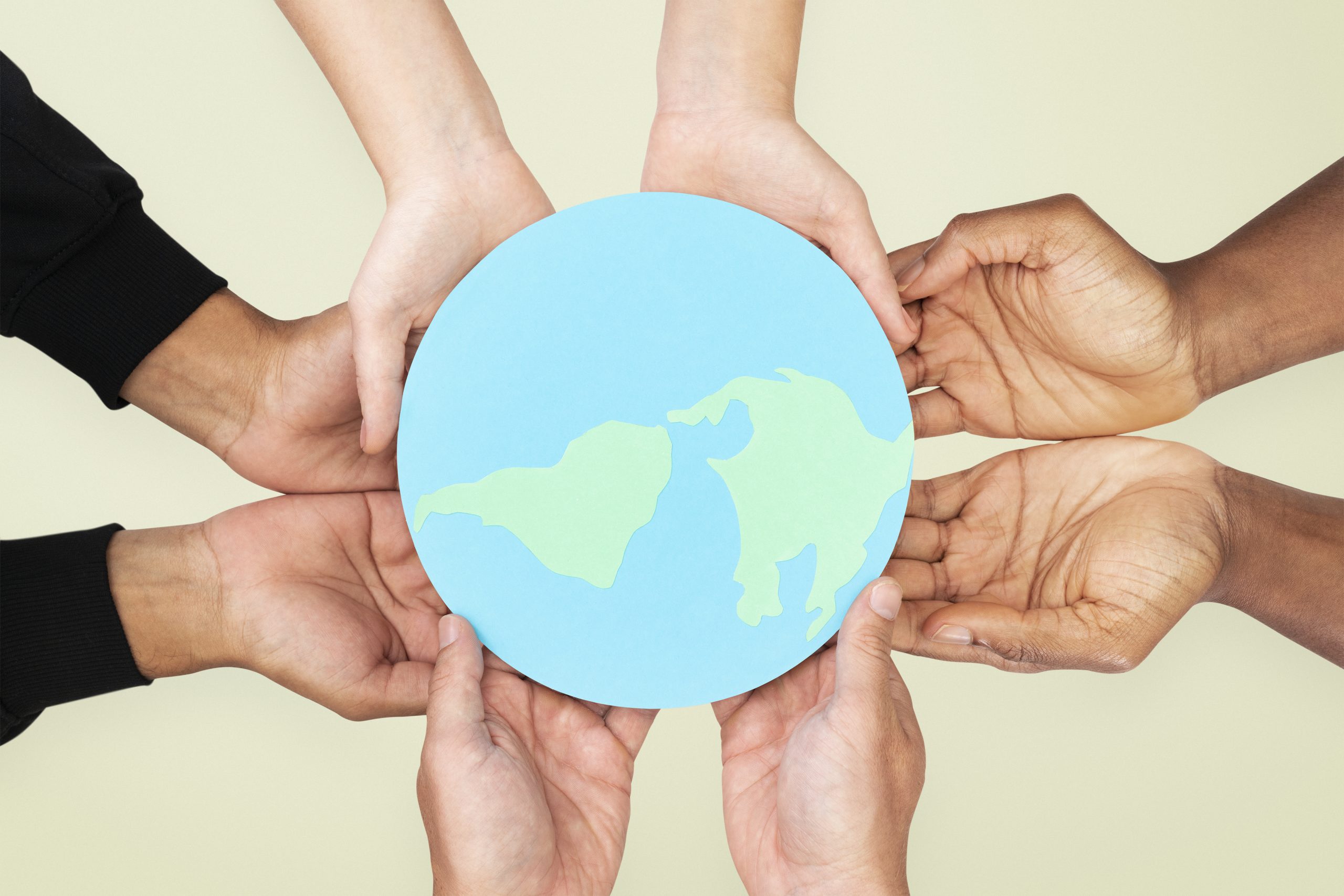 Hands holding earth save the environment campaign